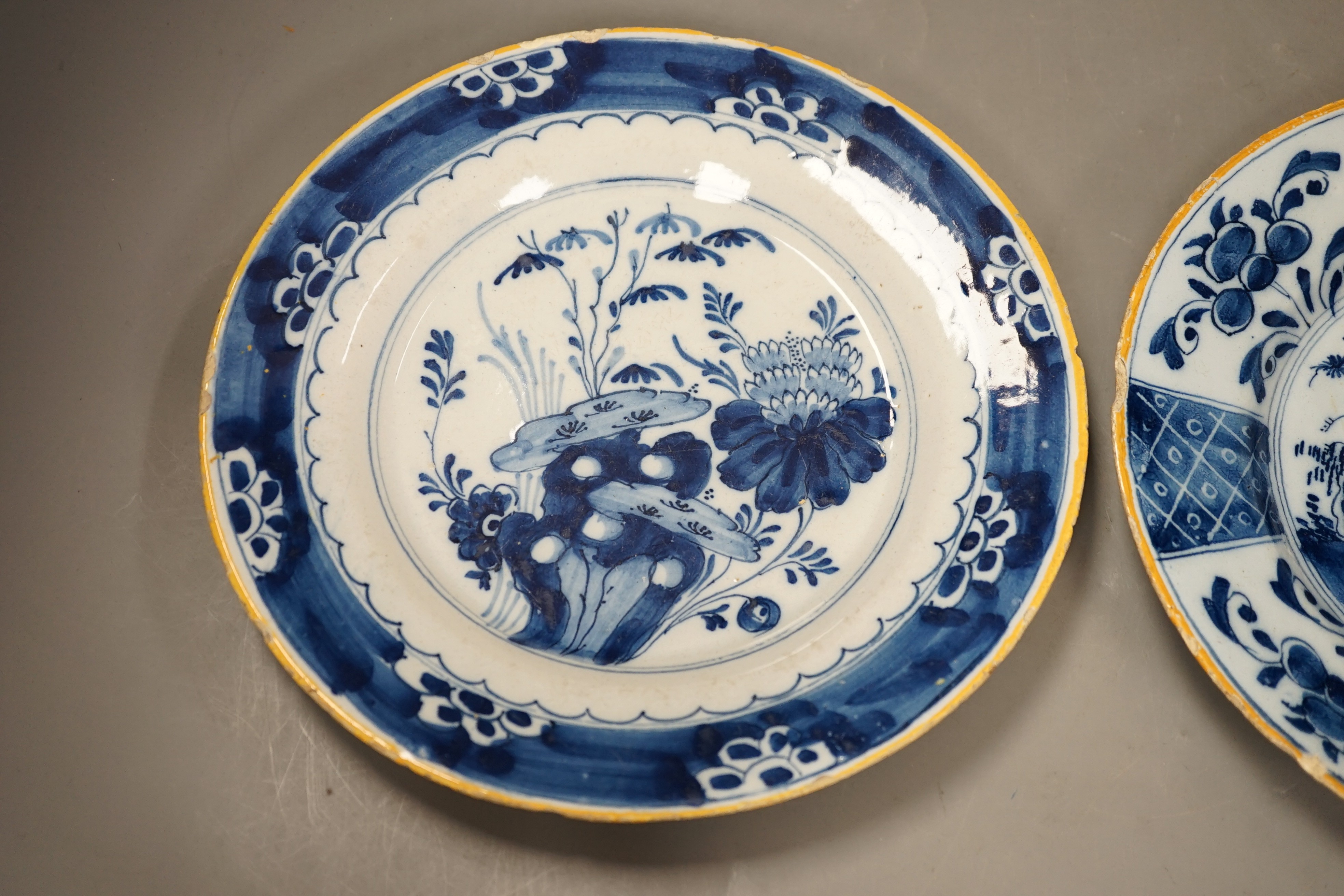 Two 18th century Dutch Delft blue and white plates, largest 23cms diameter
